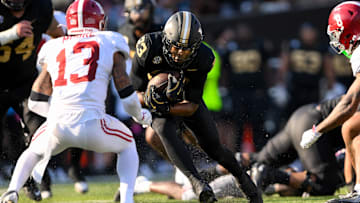 Oct 5, 2024; Nashville, Tennessee, USA;  Alabama Crimson Tide defensive back Malachi Moore (13) tackles Vanderbilt Commodores running back AJ Newberry (23) at FirstBank Stadium.