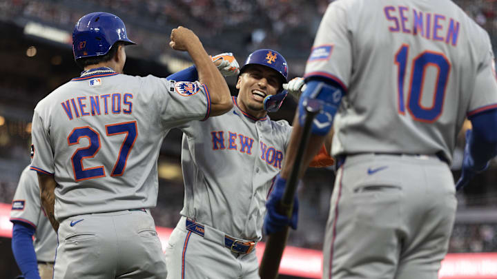 Apr 4, 2026; San Francisco, California, USA; New York Mets pinch hitter Tyrone Taylor (center) celebrates his three-run home run against the San Francisco Giants during the fifth inning at Oracle Park. Mandatory Credit: D. Ross Cameron-Imagn Images