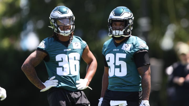 May 30, 2024; Philadelphia, PA, USA; Philadelphia Eagles running back Tyrion Davis-Price (35) and running back Kendall Milton (36) look on at practice at NovaCare Complex. Mandatory Credit: Bill Streicher-USA TODAY Sports