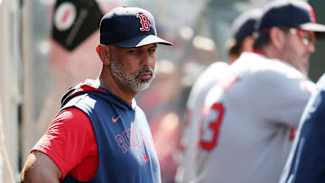 Jun 25, 2025; Anaheim, California, USA;  Boston Red Sox manager Alex Cora (13) looks down in the dugout during the eighth inning against the Los Angeles Angels at Angel Stadium. Mandatory Credit: Kiyoshi Mio-Imagn Images