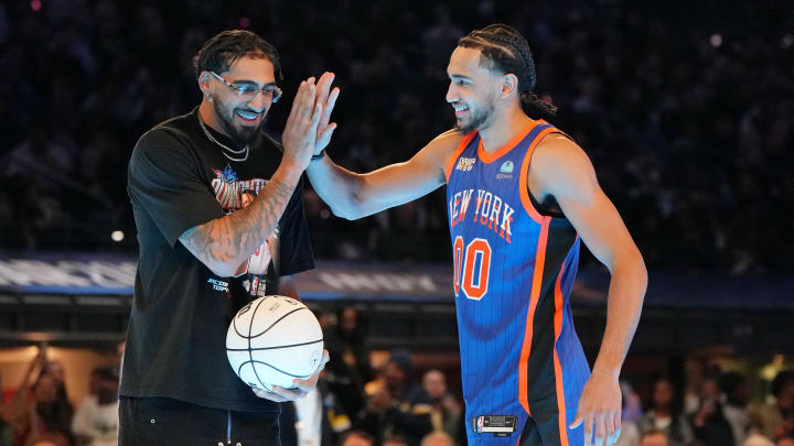 Feb 17, 2024; Indianapolis, IN, USA; New York Knicks forward Jacob Toppin (3) high fives his brother Indiana Pacers forward Obi Toppin during the slam dunk competition during NBA All Star Saturday Night at Lucas Oil Stadium. Mandatory Credit: Kyle Terada-USA TODAY Sports