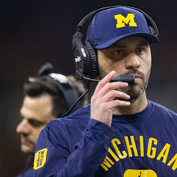 Dec 4, 2021; Indianapolis, IN, USA; Michigan Wolverines quarterbacks coach Matt Weiss against the Iowa Hawkeyes in the Big Ten Conference championship game at Lucas Oil Stadium. Mandatory Credit: Mark J. Rebilas-Imagn Images