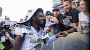 Oct 19, 2024; Tucson, Arizona, USA; Colorado Buffalos quarterback Shedeur Sanders (2) greets fans after defeating the Arizona Wildcats at Arizona Stadium.