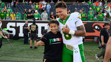 Sep 14, 2024; Corvallis, Oregon, USA; Oregon Ducks quarterback Dillon Gabriel (8) greets a fan after the game against the Oregon State Beavers at Reser Stadium. Mandatory Credit: Craig Strobeck-Imagn Images