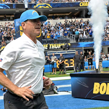 Sep 8, 2024; Inglewood, California, USA; Los Angeles Chargers head coach Jim Harbaugh leads the team on to the field for the game against the Las Vegas Raiders at SoFi Stadium. Mandatory Credit: Jayne Kamin-Oncea-Imagn Images