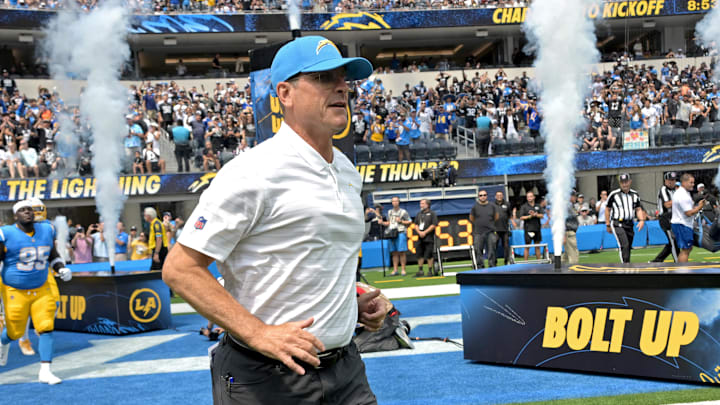 Sep 8, 2024; Inglewood, California, USA; Los Angeles Chargers head coach Jim Harbaugh leads the team on to the field for the game against the Las Vegas Raiders at SoFi Stadium. Mandatory Credit: Jayne Kamin-Oncea-Imagn Images