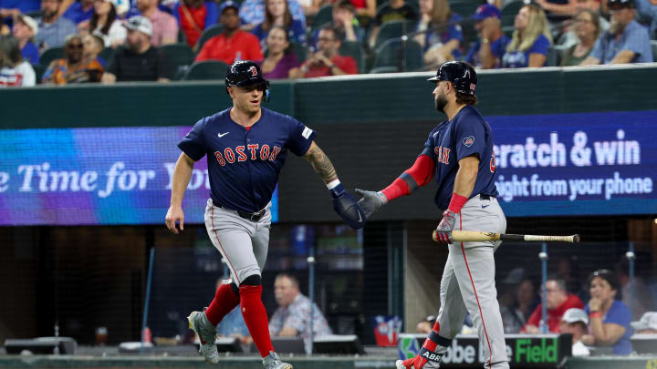 Aug 2, 2024; Arlington, Texas, USA; Boston Red Sox left fielder Tyler O'Neill (17) celebrates with  Boston Red Sox right fielder Wilyer Abreu (52) after scoring during the fourth inning against the Texas Rangers at Globe Life Field. Mandatory Credit: Kevin Jairaj-USA TODAY Sports