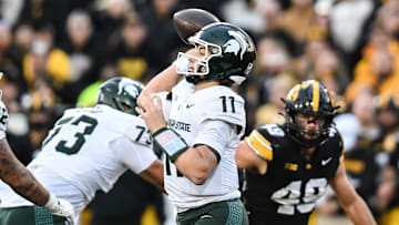 Nov 22, 2025; Iowa City, Iowa, USA; Michigan State Spartans quarterback Alessio Milivojevic (11) throws a pass against the Iowa Hawkeyes during the second quarter at Kinnick Stadium. Mandatory Credit: Jeffrey Becker-Imagn Images