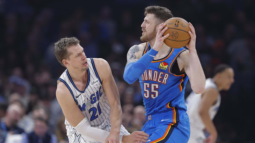 Feb 3, 2026; Oklahoma City, Oklahoma, USA; Oklahoma City Thunder center/forward Isaiah Hartenstein (55) moves the ball as Orlando Magic forward/center Moritz Wagner (21) defends during the second quarter at Paycom Center. Mandatory Credit: Alonzo Adams-Imagn Images