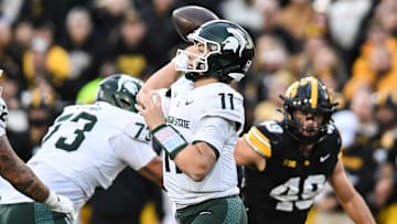 Nov 22, 2025; Iowa City, Iowa, USA; Michigan State Spartans quarterback Alessio Milivojevic (11) throws a pass against the Iowa Hawkeyes during the second quarter at Kinnick Stadium. Mandatory Credit: Jeffrey Becker-Imagn Images