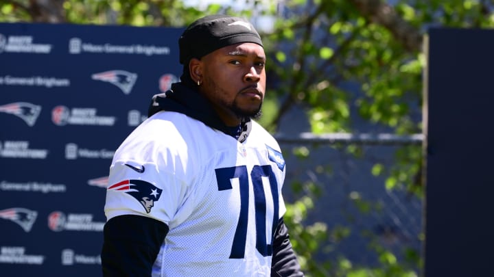 Jun 10, 2024; Foxborough, MA, USA; New England Patriots offensive tackle Caedan Wallace (70) walks to the practice fields for minicamp at Gillette Stadium. Mandatory Credit: Eric Canha-USA TODAY Sports