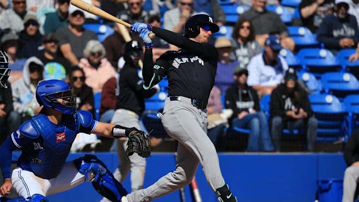 Feb 24, 2026; Dunedin, Florida, USA;  New York Yankees left fielder Cody Bellinger (35) singles during the third inning against the Toronto Blue Jays at TD Ballpark. Mandatory Credit: Kim Klement Neitzel-Imagn Images
