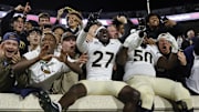 Nov 8, 2025; Charlottesville, Virginia, USA; Wake Forest Demon Deacons players celebrates with fans in the stands after defeating the Virginia Cavaliers at Scott Stadium. Mandatory Credit: Amber Searls-Imagn Images