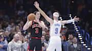 Mar 31, 2025; Oklahoma City, Oklahoma, USA; Chicago Bulls guard Josh Giddey (3) looks to pass as Oklahoma City Thunder guard Alex Caruso (9) defends during the second quarter at Paycom Center. Mandatory Credit: Alonzo Adams-Imagn Images