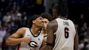 Mar 12, 2025; Nashville, TN, USA;  Georgia Bulldogs guard Silas Demary Jr. (5) reacts after a made three point basket  with center Somto Cyril (6) against the Oklahoma Sooners during the first half at Bridgestone Arena. Mandatory Credit: Steve Roberts-Imagn Images