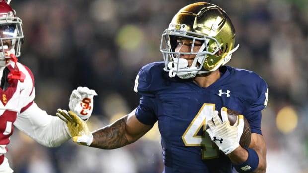 Chris Tyree runs the ball for Notre Dame in a blowout win over USC in 2023.