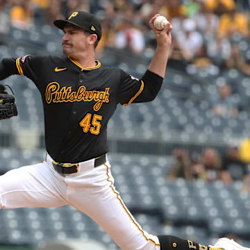 May 21, 2025; Pittsburgh, Pennsylvania, USA;  Pittsburgh Pirates starting pitcher Andrew Heaney (45) delivers a pitch against the Cincinnati Reds during the first inning at PNC Park. Mandatory Credit: Charles LeClaire-Imagn Images