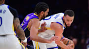 Feb 6, 2025; Los Angeles, California, USA; Golden State Warriors guard Stephen Curry (30) controls the ball against Los Angeles Lakers guard Gabe Vincent (7) during the second half at Crypto.com Arena. Mandatory Credit: Gary A. Vasquez-Imagn Images