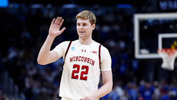 Mar 22, 2025; Denver, CO, USA; Wisconsin Badgers forward Steven Crowl (22) reacts against the Brigham Young Cougars during the second half in the second round of the NCAA Tournament  at Ball Arena. Mandatory Credit: Ron Chenoy-Imagn Images