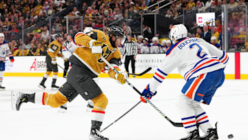 Vegas Golden Knights center William Karlsson (71) shoots against the stick of Edmonton Oilers defenseman Evan Bouchard (2)