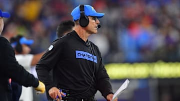 Dec 19, 2024; Inglewood, California, USA; Los Angeles Chargers head coach Jim Harbaugh watches game action before playing against the Denver Broncos during the first half at SoFi Stadium. Mandatory Credit: Gary A. Vasquez-Imagn Images