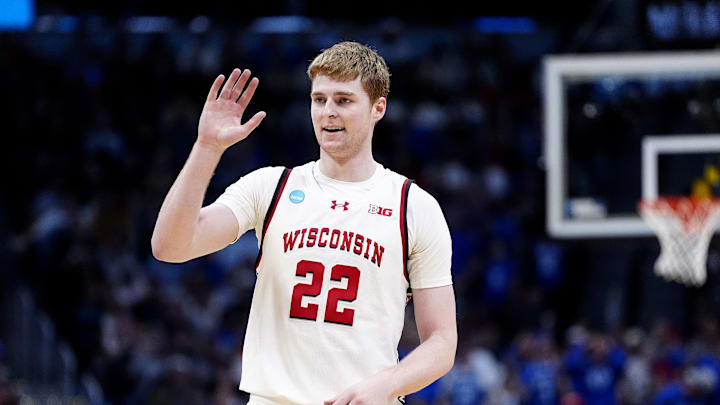 Mar 22, 2025; Denver, CO, USA; Wisconsin Badgers forward Steven Crowl (22) reacts against the Brigham Young Cougars during the second half in the second round of the NCAA Tournament  at Ball Arena. Mandatory Credit: Ron Chenoy-Imagn Images