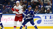 Sep 24, 2024; Tampa, Florida, USA; Carolina Hurricanes defenseman Charles-Alexis Legault (62) and Tampa Bay Lightning center Anthony Cirelli (71) during the third period at Amalie Arena. Mandatory Credit: Kim Klement Neitzel-Imagn Images