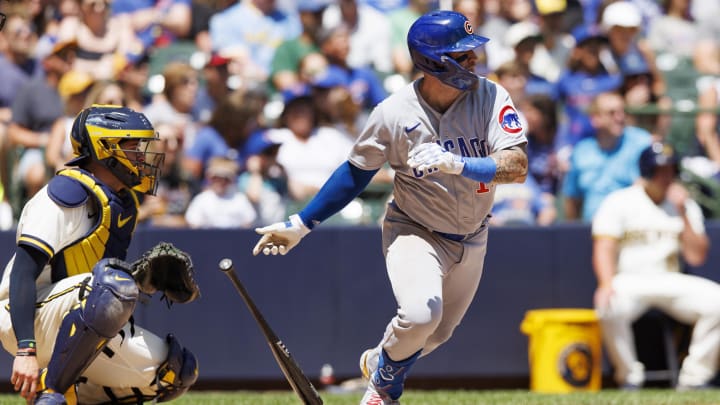 Jul 3, 2023; Milwaukee, Wisconsin, USA;  Chicago Cubs catcher Tucker Barnhart (18) hits an RBI single during the third inning against the Milwaukee Brewers at American Family Field. 