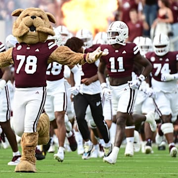 Mississippi State Bulldogs players run onto the field before the game against Eastern Kentucky Colonels at Davis Wade Stadium at Scott Field.