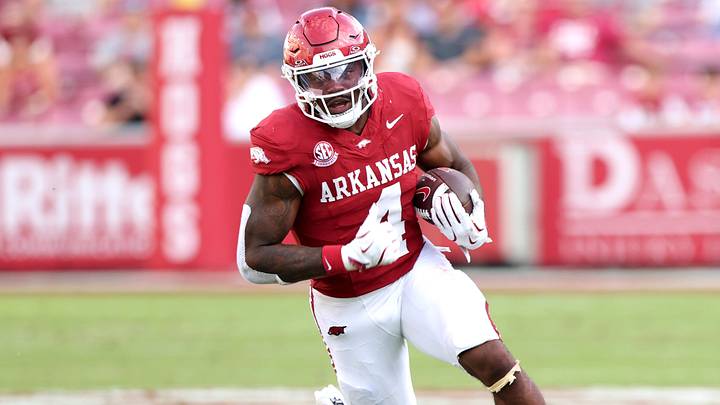 Aug 30, 2025; Fayetteville, Arkansas, USA; Arkansas Razorbacks running back Mike Washington Jr (4) rushes during the fourth quarter against the Alabama A&M Bulldogs at Donald W. Reynolds Razorback Stadium. Mandatory Credit: Nelson Chenault-Imagn Images