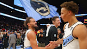Dec 6, 2024; Atlanta, Georgia, USA; Atlanta Hawks guard Trae Young (11) celebrates with guard Dyson Daniels (5) after an overtime victory over the Los Angeles Lakers at State Farm Arena. Mandatory Credit: Brett Davis-Imagn Images
