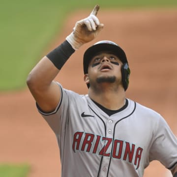 Aug 5, 2024; Cleveland, Ohio, USA; Arizona Diamondbacks catcher Gabriel Moreno (14) celebrates his solo home run in the first inning against the Cleveland Guardians at Progressive Field. Mandatory Credit: David Richard-USA TODAY Sports