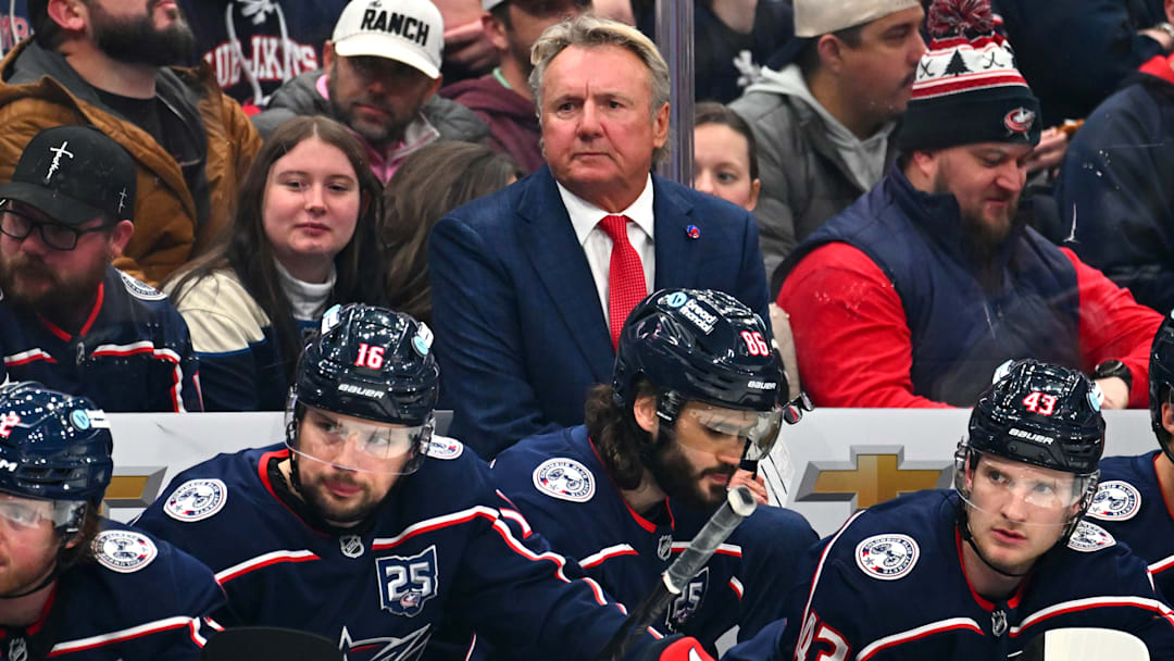 Blue Jackets head coach Rick Bowness stands behind the bench in his first game.