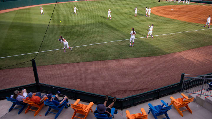 Fans sit in the left field while watching the Gators warm up. The Florida women   s softball team