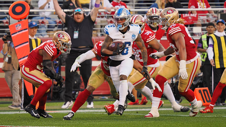 Jan 28, 2024; Santa Clara, California, USA; Detroit Lions running back Jahmyr Gibbs (26) runs with the ball for a touchdown San Francisco 49ers during the first half of the NFC Championship football game at Levi's Stadium. Mandatory Credit: Kelley L Cox-Imagn Images