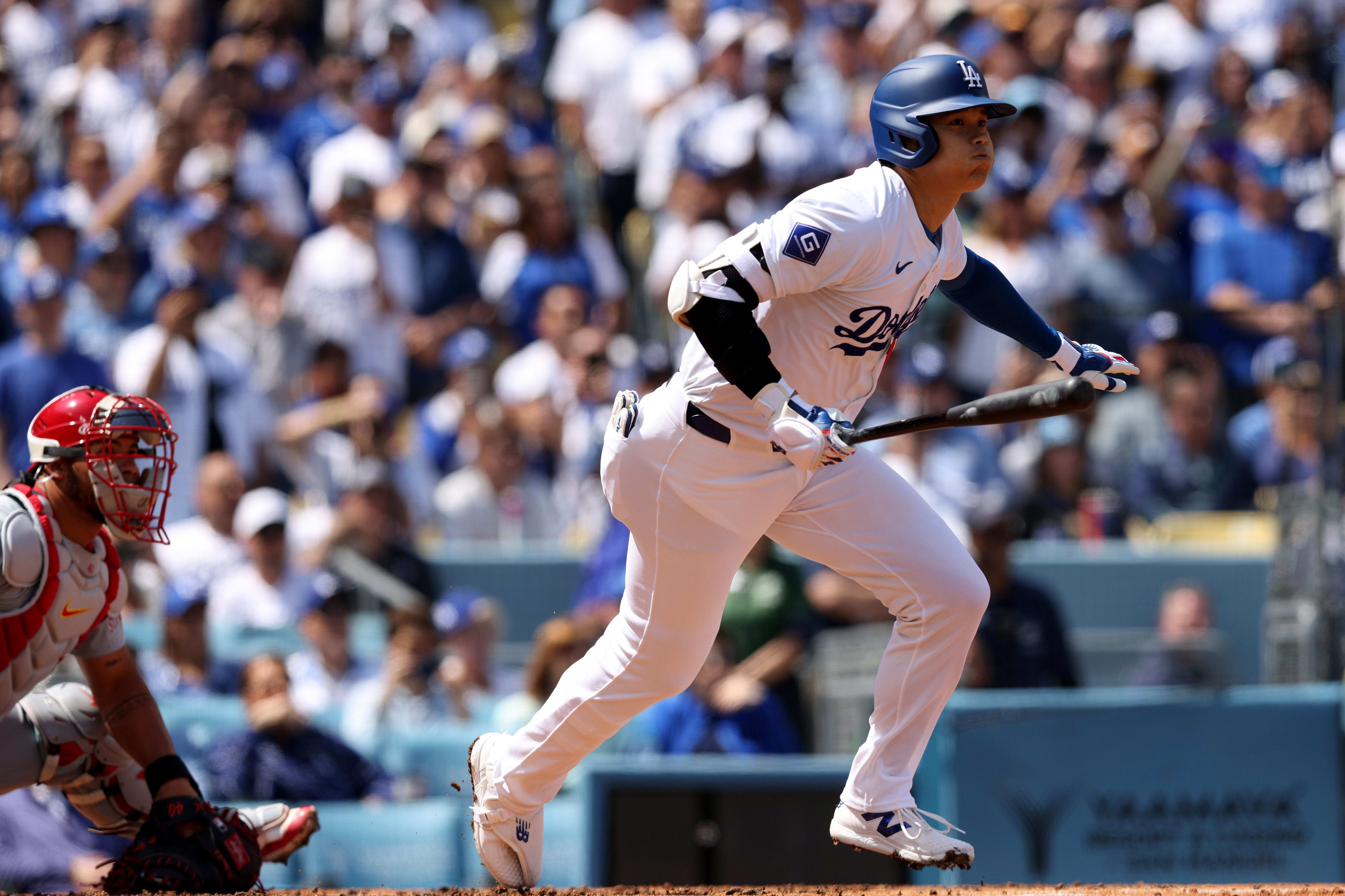 Los Angeles Dodgers designated hitter Shohei Ohtani hits the baseball.