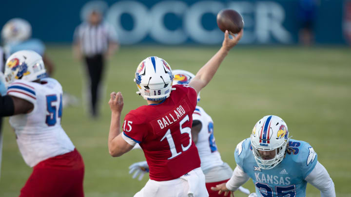 Kansas redshirt freshman quarterback Cole Ballard (15) throws a pass during Friday's Spring Preview at Rock Chalk Park.