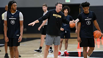 Vanderbilt head coach Mark Byington instructs forward Devin McGlockton (99) and guard A.J. Hoggard (11) during an NCAA college basketball practice Tuesday, October 8, 2024, in Nashville, Tenn.