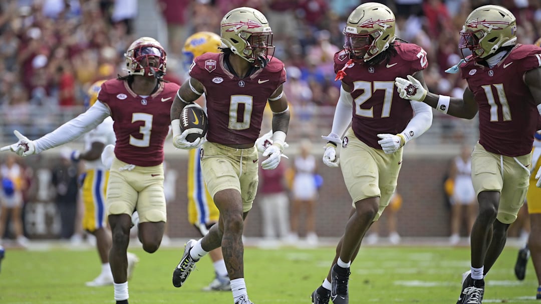 Oct 11, 2025; Tallahassee, Florida, USA; Florida State Seminoles safety Earl Little Jr. (0), defensive back Ashlynd Barker (27), defensive back Edwin Joseph (3), and defensive back Ja'Bril Rawls (11) celebrate after an interception during the first half of the game against the Pittsburgh Panthers at Doak S. Campbell Stadium. Mandatory Credit: Melina Myers-Imagn Images