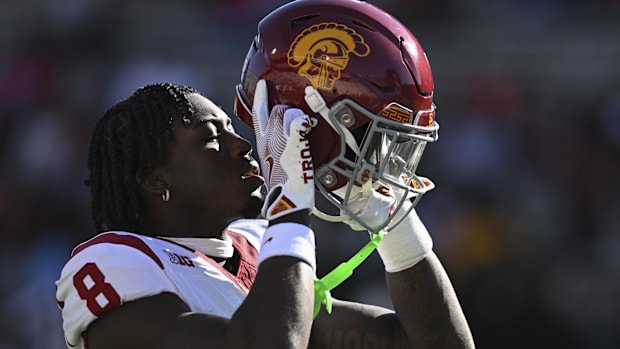 USC football player puts his helmet on during a 2024 gam