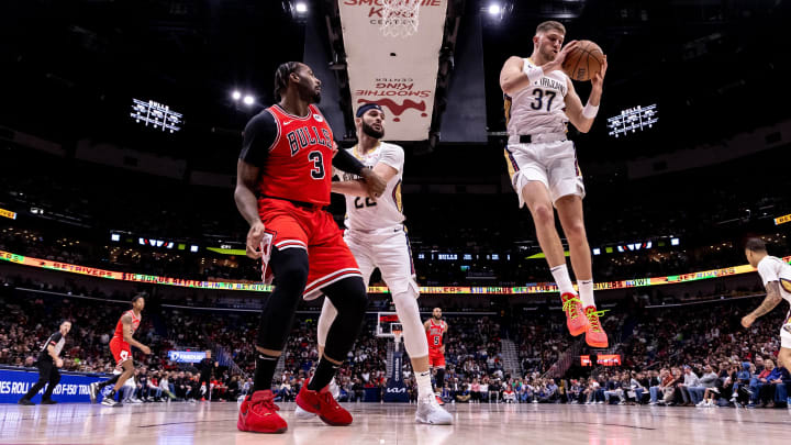 Feb 25, 2024; New Orleans, Louisiana, USA; New Orleans Pelicans forward Matt Ryan (37) grabs a rebound against Chicago Bulls center Andre Drummond (3) during the first half at Smoothie King Center. Mandatory Credit: Stephen Lew-USA TODAY Sports