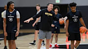 Vanderbilt head coach Mark Byington instructs forward Devin McGlockton (99) and guard A.J. Hoggard (11) during an NCAA college basketball practice Tuesday, October 8, 2024, in Nashville, Tenn.