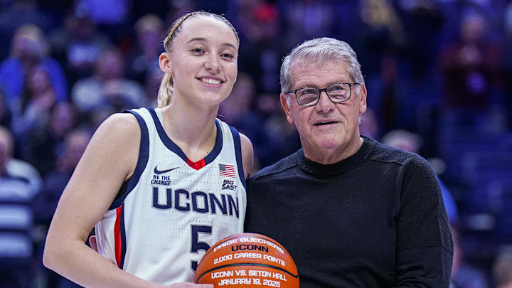 Jan 22, 2025; Storrs, Connecticut, USA; UConn Huskies guard Paige Bueckers (5) is recognized with head coach Geno Auriemma for her 2000 career points before the start of the game against the Villanova Wildcats at Harry A. Gampel Pavilion. Mandatory Credit: David Butler II-Imagn Images