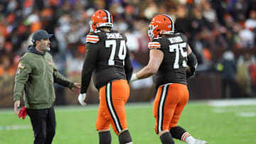 Nov 16, 2025; Cleveland, Ohio, USA; Cleveland Browns head coach Kevin Stefanski high-fives guard Teven Jenkins (74) and guard Teven Jenkins (74) during the first quarter against the Baltimore Ravens at Huntington Bank Field. Mandatory Credit: Scott Galvin-Imagn Images