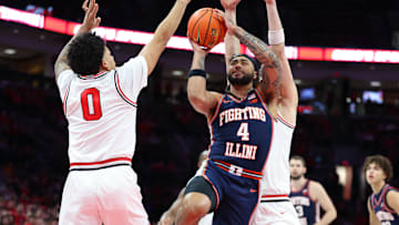 Dec 9, 2025; Columbus, Ohio, USA;  Illinois Fighting Illini guard Kylan Boswell (4) drives to the basket as Ohio State Buckeyes guard John Mobley Jr. (0) defends during the first half Value City Arena. Mandatory Credit: Joseph Maiorana-Imagn Images