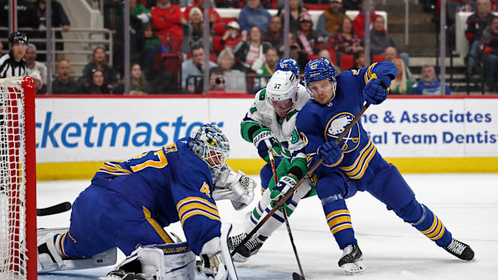 Henri Jokiharju (10) defending the net in a game against the Carolina Hurricanes.