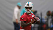 Jul 23, 2025; Miami Gardens, FL, USA; Miami Dolphins quarterback Tua Tagovailoa (1) works during training camp at Baptist Health Training Complex. Mandatory Credit: Sam Navarro-Imagn Images