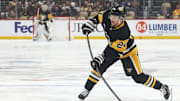 Mar 13, 2025; Pittsburgh, Pennsylvania, USA;  Pittsburgh Penguins defenseman Matt Grzelcyk (24) shoots the puck against the St. Louis Blues during the first period at PPG Paints Arena. Mandatory Credit: Charles LeClaire-Imagn Images