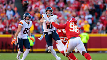 KANSAS CITY, MO - NOVEMBER 10: Denver Broncos quarterback Bo Nix (10) passes over Kansas City Chiefs defensive tackle Tershawn Wharton (98) on November 10th, 2024 at GEHA Field Arrowhead Stadium in Kansas City, Missouri.
