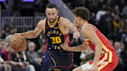 November 20, 2024; San Francisco, California, USA; Golden State Warriors guard Stephen Curry (30) dribbles the basketball against Atlanta Hawks guard Dyson Daniels (5) during the fourth quarter at Chase Center. Mandatory Credit: Kyle Terada-Imagn Images